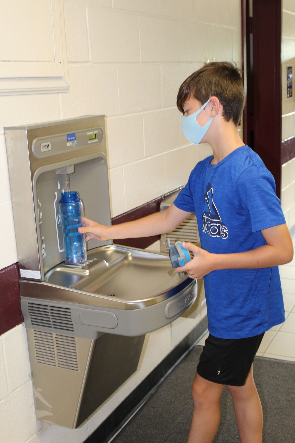 student using water station